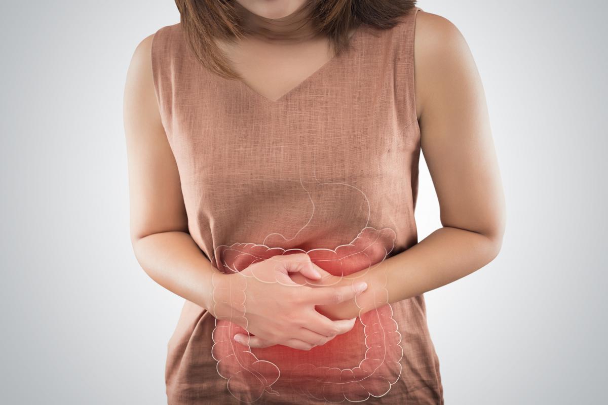 Woman holding aching stomach