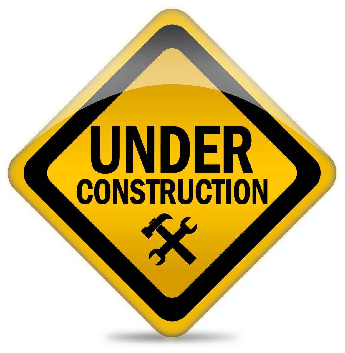 An image of a road sign that says under construction.
