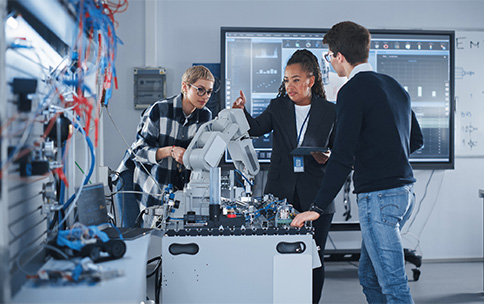 Three researchers working on the prototype.