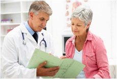 Doctor reviewing chart with patient
