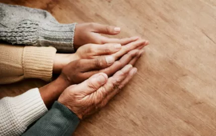 Image of hands of individuals of multiple ages