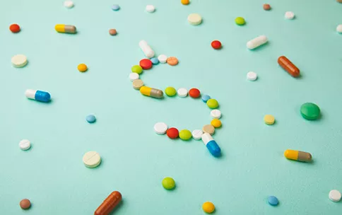 The dollar sign from the pills.